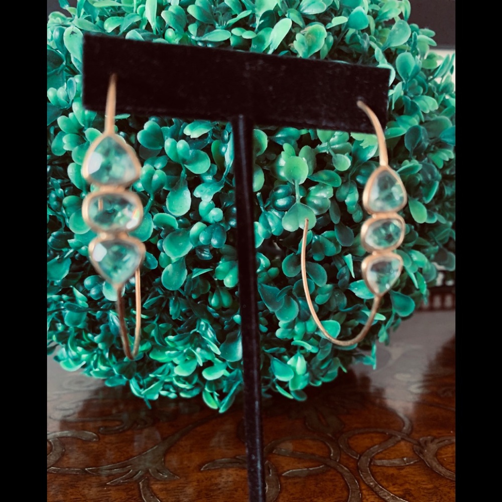 Gold earring with clear stone